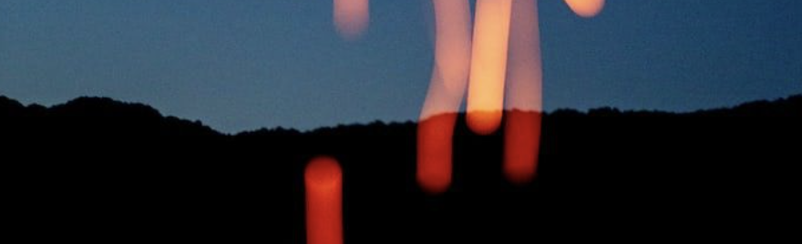 Warm blurred lights against a deep blue dusk sky