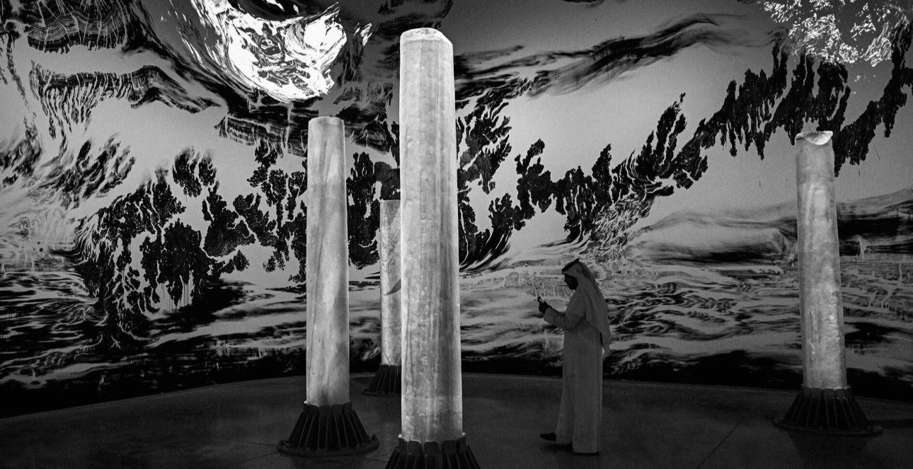 Visitor taking in an immersive art installation